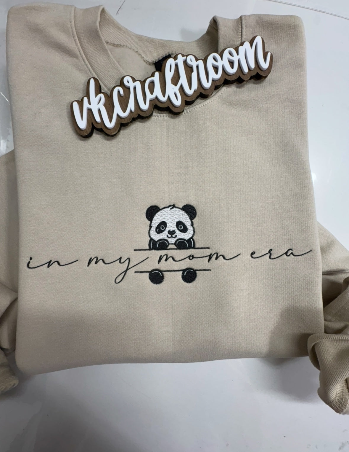 Sand-colored In My Mom Era embroidered sweatshirt with a black-and-white panda